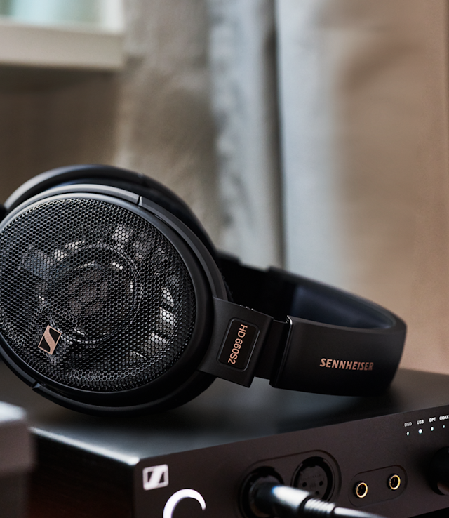 HD 660S2 resting on a desktop DAC/amp
